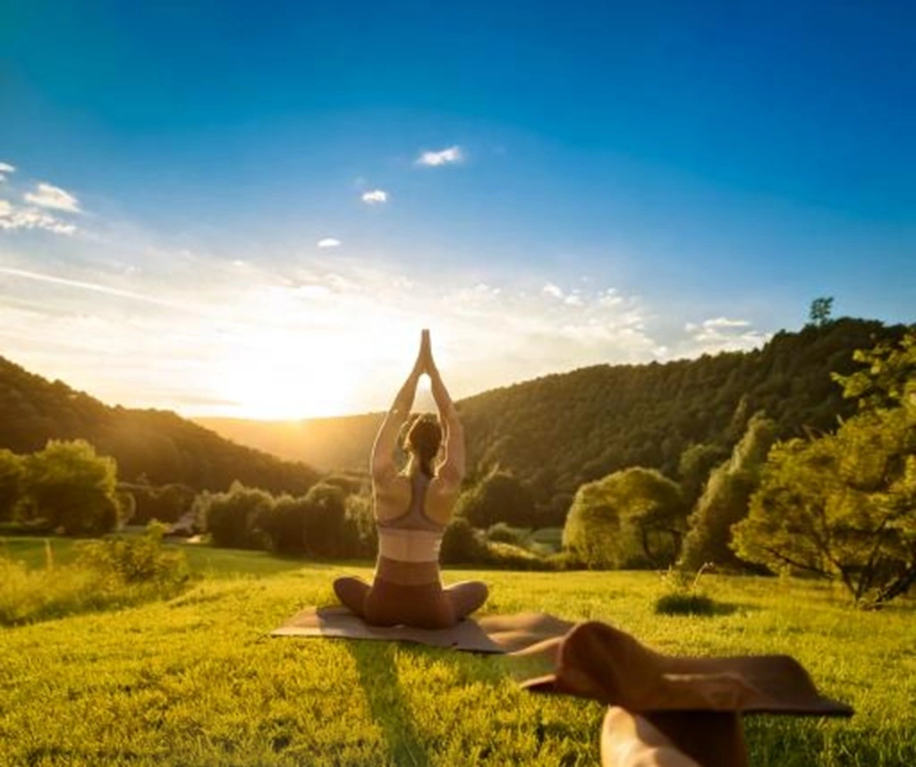 Illustration of a person engaging in various self-care activities like exercise, journaling, and meditation